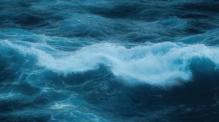 Fototapeta premium Dynamic ocean waves with white frothy foam and deep blue water surface in motion