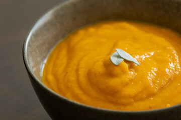 creamy butternut squash pumpkin soup with sage and pumpkin seeds cozy fall dinner