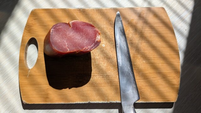 Fresh Meat Preparation on a Beautiful Wooden Cutting Board for Culinary Enthusiasts