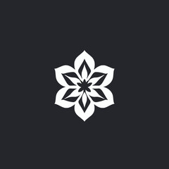 A stylized white flower graphic centered against a dark background.
