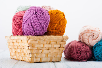 balls of wool on white wooden