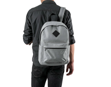 A person seen from the back wearing a grey backpack with a black diamond patch