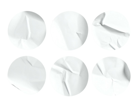 Six white, circular paper stickers, each with a slightly different, crumpled texture