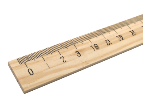 Wooden measuring tool with numbered gradations. Angled view against black background
