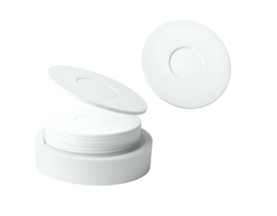 Isolated shot of a stack of white circular items, some open, arranged against a dark background