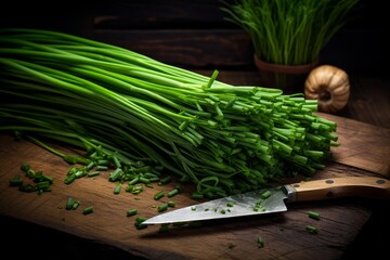 Fresh chives are chopped on a wooden cutting board, ready to enhance culinary creations