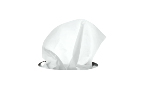 A partially extracted white tissue sits within a dark, circular container against a black background