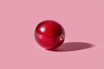 Cranberry on Pink Background: Close-Up Shot of Fresh Fruit