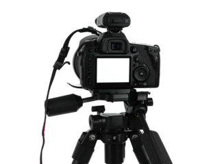 Back of a digital camera mounted on a tripod against a black background