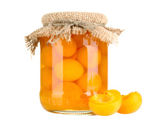 Glass jar filled with preserved golden apricot halves, covered with burlap
