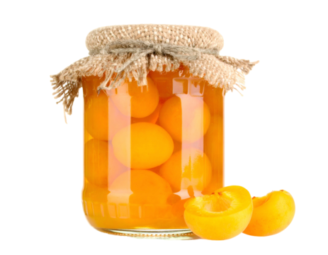 Glass jar filled with preserved golden apricot halves, covered with burlap