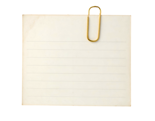 Close-up of a lined memo paper with a gold paperclip attached on black backdrop