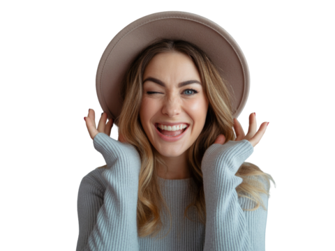 Joyful young woman wearing a hat winks and smiles embracing happiness close up portrait