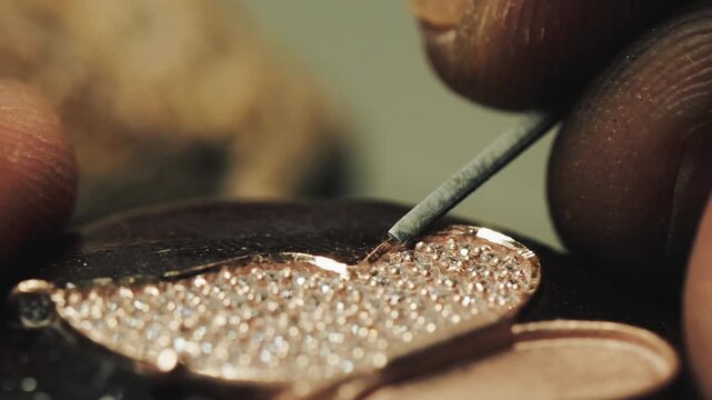 Artisan crafting elegant jewelry with precision &mdash; showcasing the detailed handmade process of designing, shaping, and polishing fine metal ornaments in a workshop.