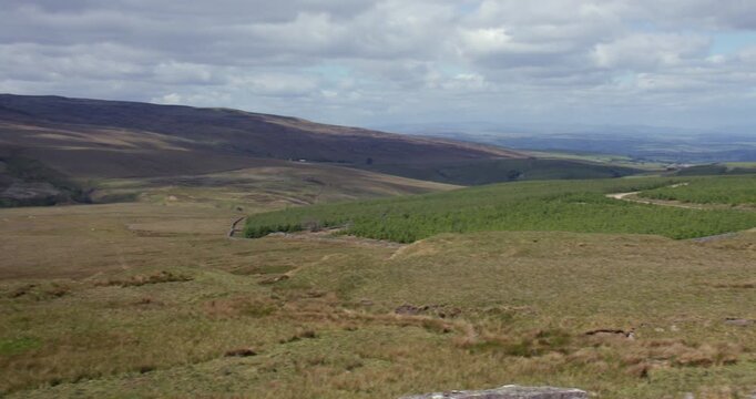 Extra wide panning shot looking east down Kaber fell, and Bowes moor next to the Regional RTE 71, At the pennines