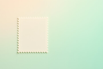 Empty vintage postage stamp on a pastel background