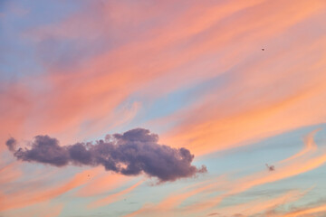 Beautiful pastel sunset sky with pink and orange clouds.