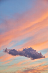 Beautiful pastel sunset sky with pink and orange clouds.