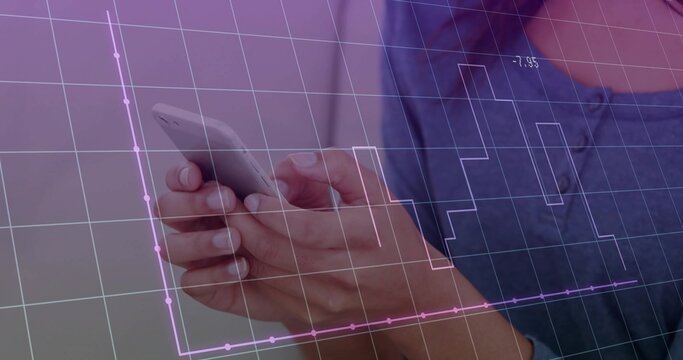 Businesswoman wearing denim shirt holding smartphone in office, with digital grid and chart overlay