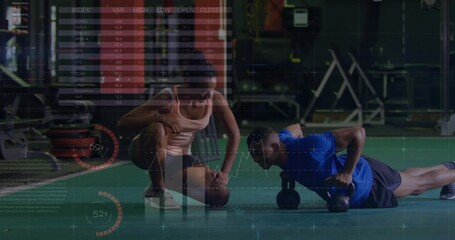 Performing push-ups fitness trainer guiding client on turf, with dumbbells and metrics