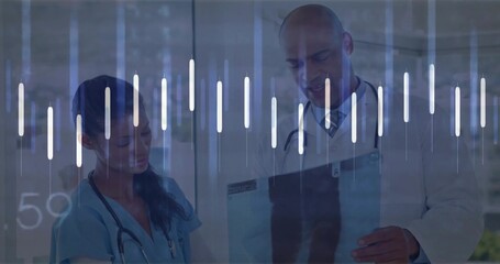 Reviewing nurse and doctor studying X-ray film in hospital hall, with stethoscopes, digital overlay