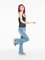 Asian confident young woman purple short hair standing posing wearing black sleeveless top blue...