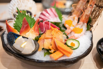 Fresh sashimi set serve on ice with wasabi Japanese style