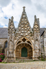 Doorway of the Church of Notre-Dame de Rescudon in Pont-Croix, in Brittany, France, built between the 13th and 16th centuries with a 67-metre high bell tower