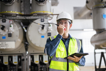Male engineer inspection of high-voltage gas-insulated switchgear, ensuring safety, control, and...