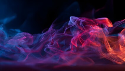 Abstract swirling colorful smoke or vapor illuminated with vibrant neon blue pink and orange light against a dark background for graphic design