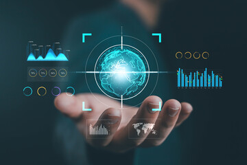 Businessman holding digital globe with data analytics interface, concept of global technology, big data visualization, business intelligence, and worldwide digital innovation of finance, investment,