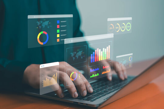 Businessman using laptop with digital data analytics dashboard, concept of big data, business intelligence, statistics visualization, marketing performance, and financial analysis.