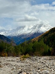 Fototapeta premium Autumn Landscape with Snow-Capped Mountain Peaks