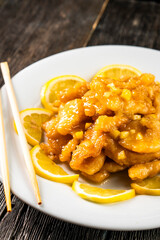 Crispy Lemon Chicken with Sweet and Sour Lemon Sauce - Chinese Style. Chinese cuisine. Food concepts.