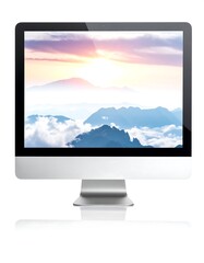 Fototapeta premium A modern computer display, with a sleek silver frame and stand, shows a scenic landscape featuring a vibrant sky and mountain vista. Its reflection is visible below