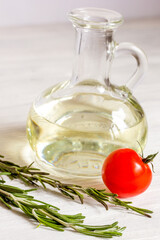 tomato with olive oil on wooden background