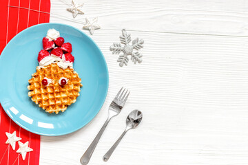 breakfast for child on Christmas with waffle top view