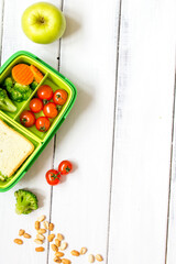 preparing lunch for child school top view on wooden background