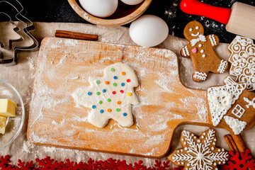 cooking christmas gingerbread on wooden background top view