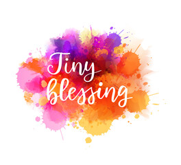 Tiny blessing -  inspirational handwritten modern calligraphy lettering on multicolored watercolor painted splash. Template typography. Gender reveal conceptual design