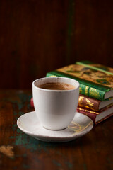 Cup of coffee on rustic wooden background. Soft focus. Copy space	