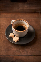 Cup of coffee on rustic wooden background. Soft focus. Copy space	