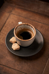 Cup of coffee on rustic wooden background. Soft focus. Copy space	