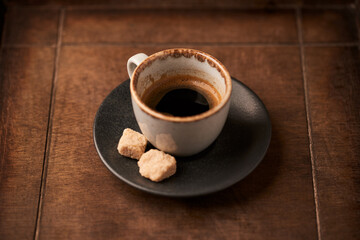Cup of coffee on rustic wooden background. Soft focus. Copy space	