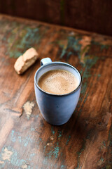 Cup of coffee on rustic wooden background. Soft focus. Copy space	