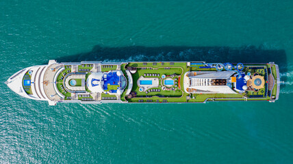 Cruise ships sailing the sea take tourists on a journey and relax on holidays.