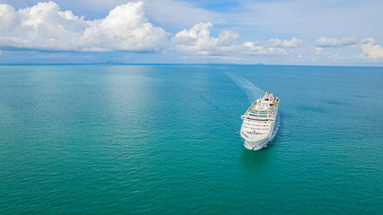 Cruise ships sailing the sea take tourists on a journey and relax on holidays.