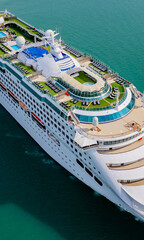 Cruise ships sailing the sea take tourists on a journey and relax on holidays.