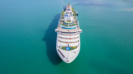 Cruise ships sailing the sea take tourists on a journey and relax on holidays.