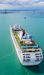 Cruise ships sailing the sea take tourists on a journey and relax on holidays.